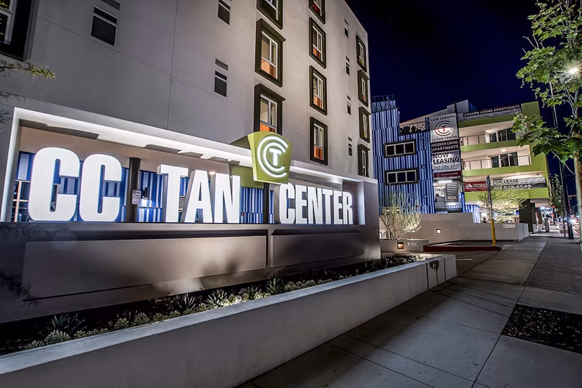 CC Tan Center Apartments: Modern signage at luxury apartment complex entrance in prime urban location