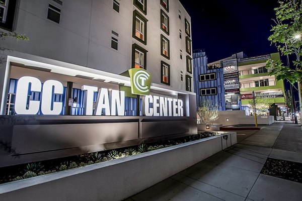 CC Tan Center Apartments: Modern signage at luxury apartment complex entrance in prime urban location
