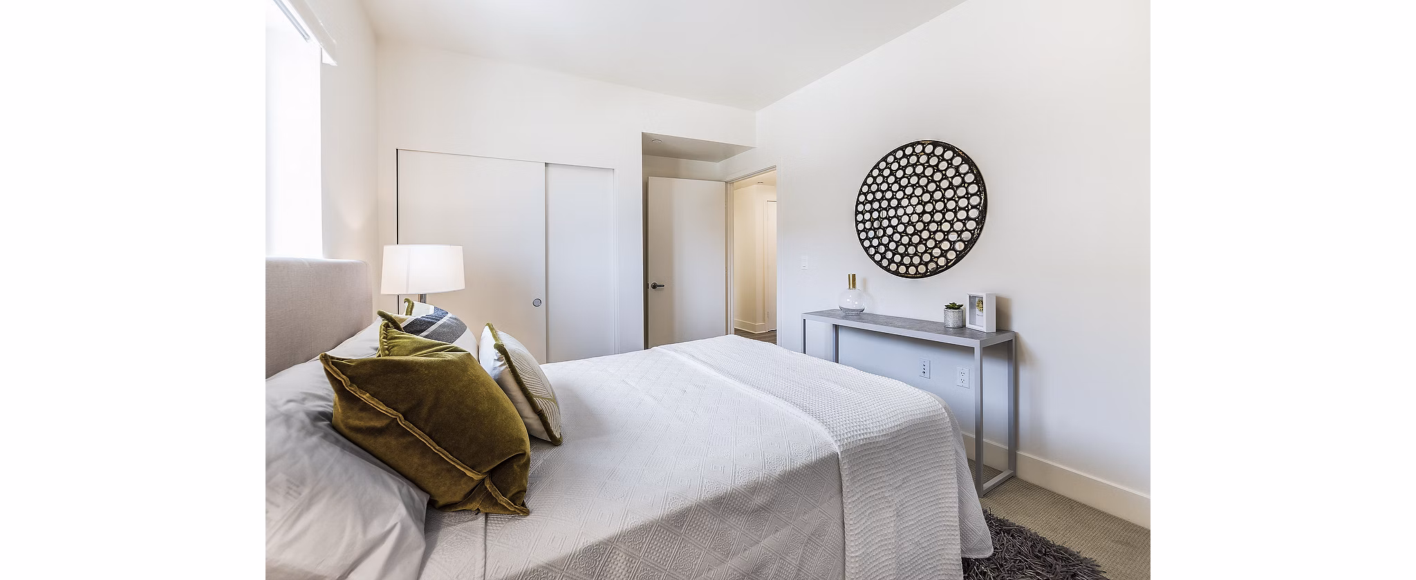 Modern bedroom with stylish decor at CC Tan Center Apartments