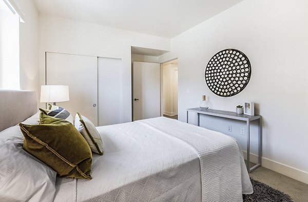 Modern bedroom with stylish decor at CC Tan Center Apartments