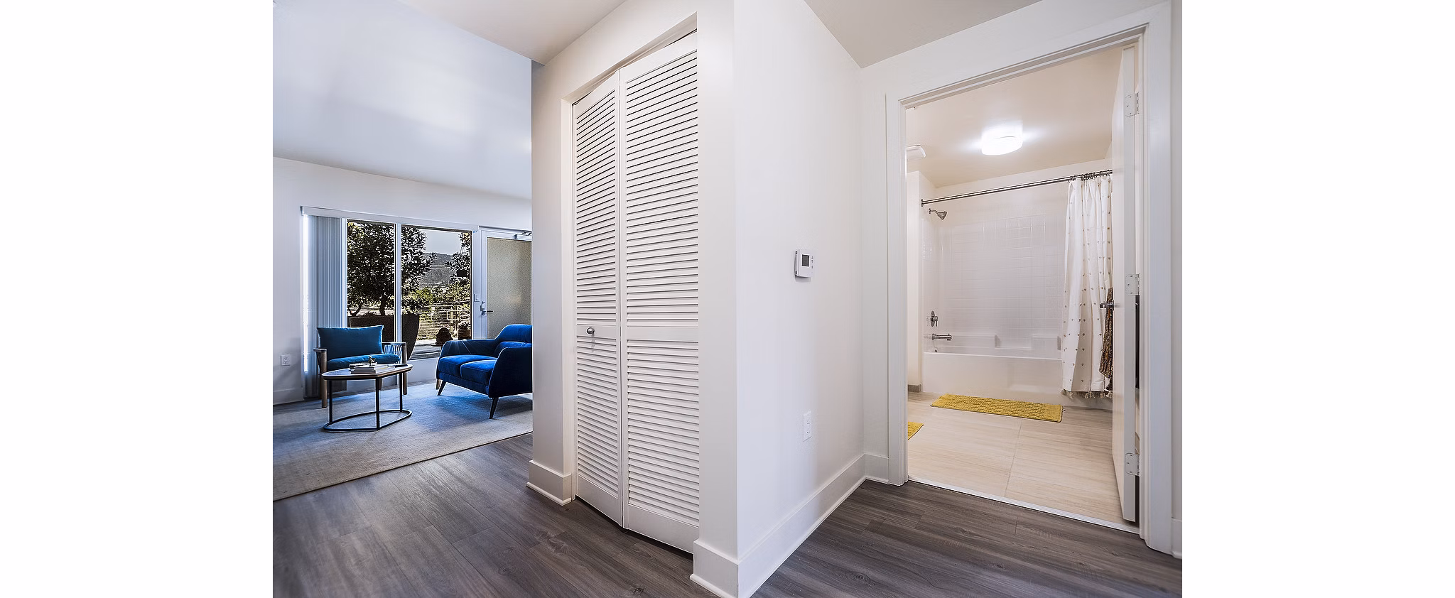 Laundry room with modern washers and dryers at CC Tan Center Apartments