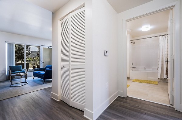 Laundry room with modern washers and dryers at CC Tan Center Apartments