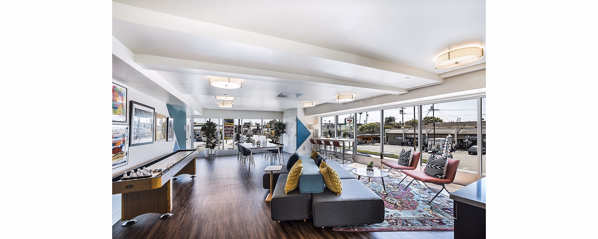 Game room with pool table and arcade games at CC Tan Center Apartments