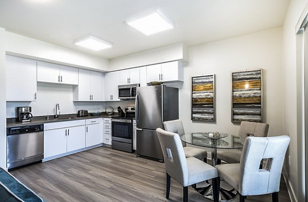 Dining room with modern decor and hardwood flooring in CC Tan Center Apartments