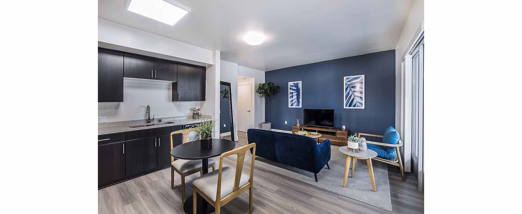 Dining room with modern furnishings in CC Tan Center Apartments, ideal for luxury living
