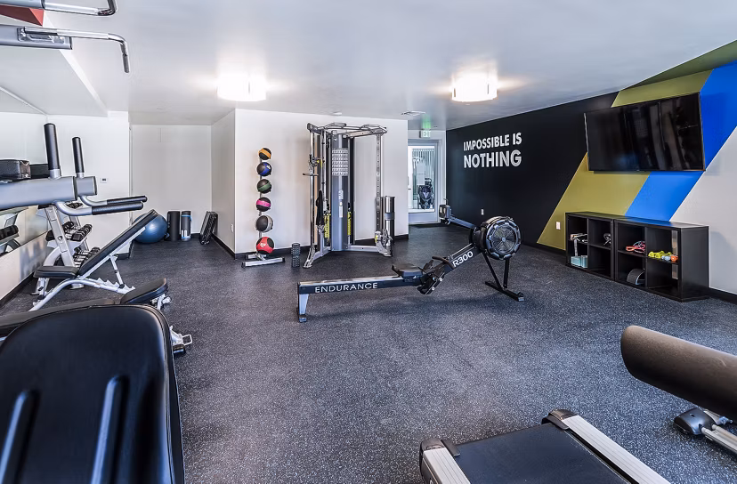 Modern fitness center with state-of-the-art equipment at CC Tan Center Apartments