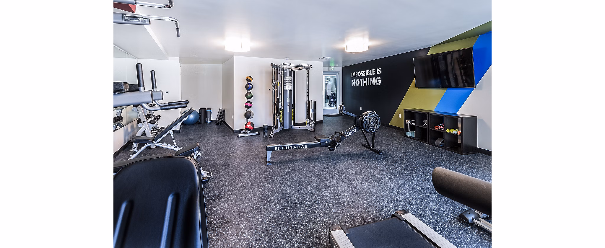 Modern fitness center with state-of-the-art equipment at CC Tan Center Apartments