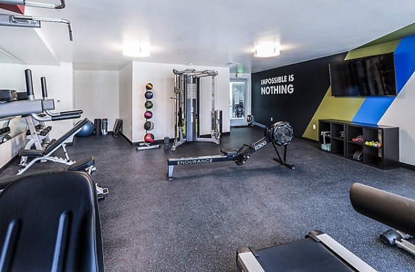 Modern fitness center with state-of-the-art equipment at CC Tan Center Apartments