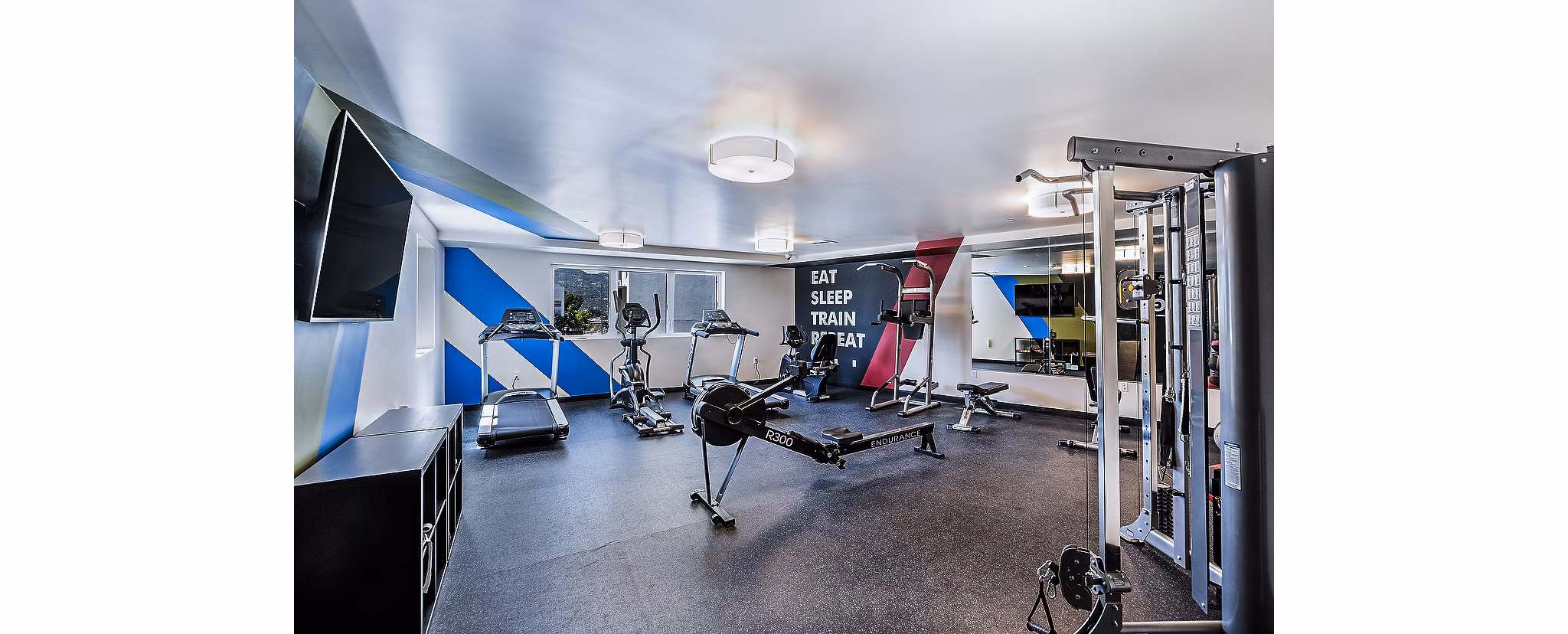 Modern fitness center with state-of-the-art equipment at CC Tan Center Apartments
