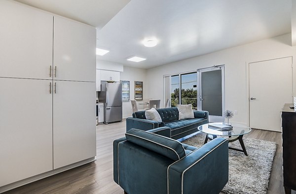 Modern living room with sleek furnishings at CC Tan Center Apartments