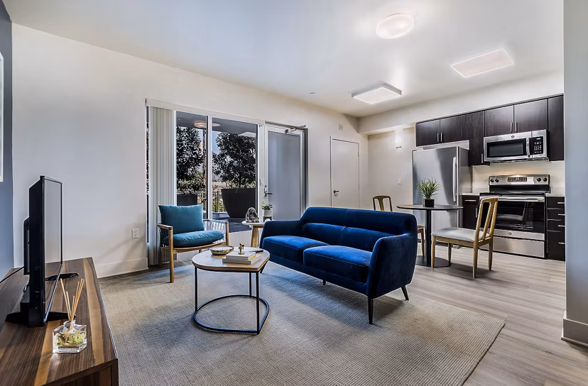 Spacious living room with modern decor at CC Tan Center Apartments, showcasing luxury living