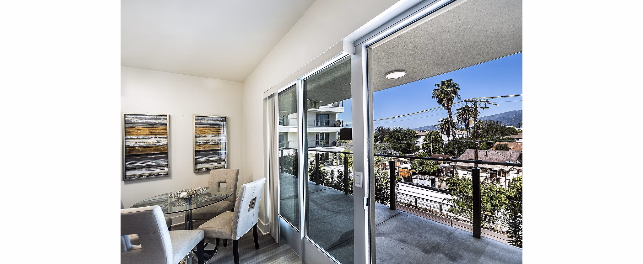 Balcony with outdoor seating at CC Tan Center Apartments, luxury apartments by Greystar