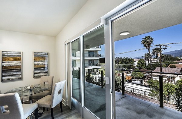 Balcony with outdoor seating at CC Tan Center Apartments, luxury apartments by Greystar