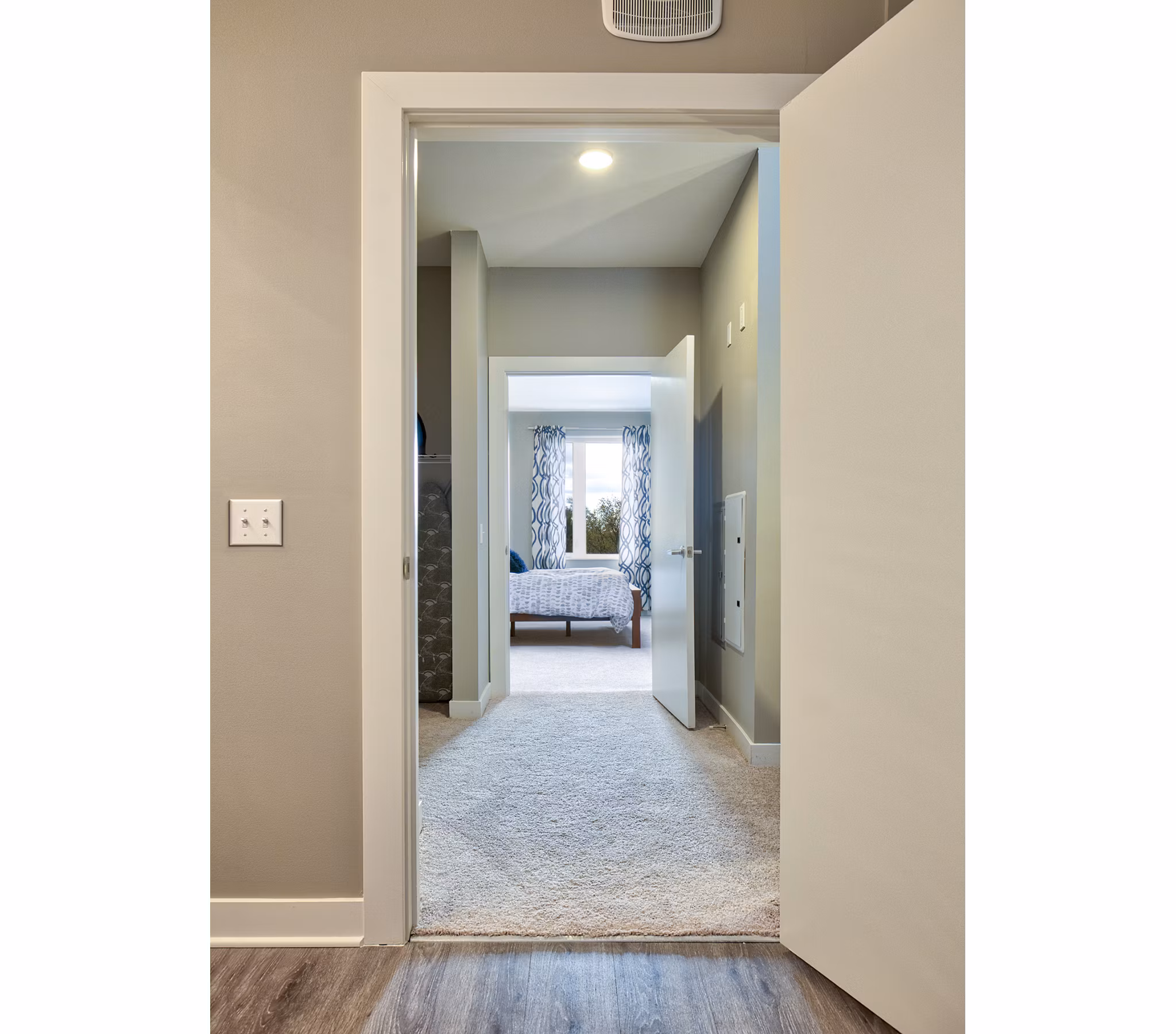 Hallway with modern lighting and decor at Ridge at Robinson Apartments