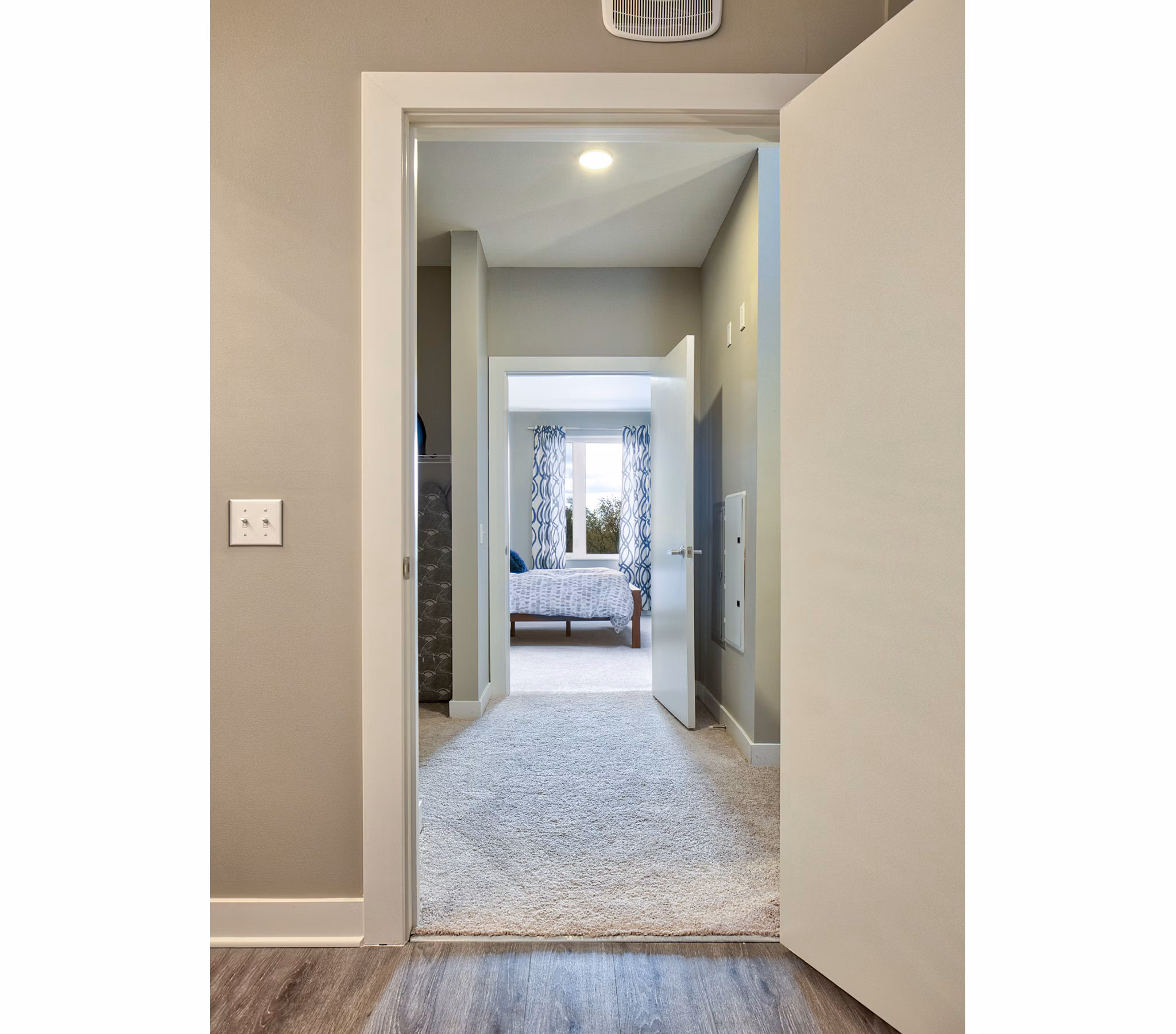 Hallway with modern lighting and decor at Ridge at Robinson Apartments