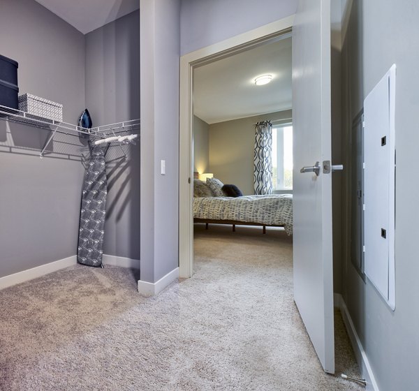 Walk-in closet with ample shelving in Ridge at Robinson Apartments