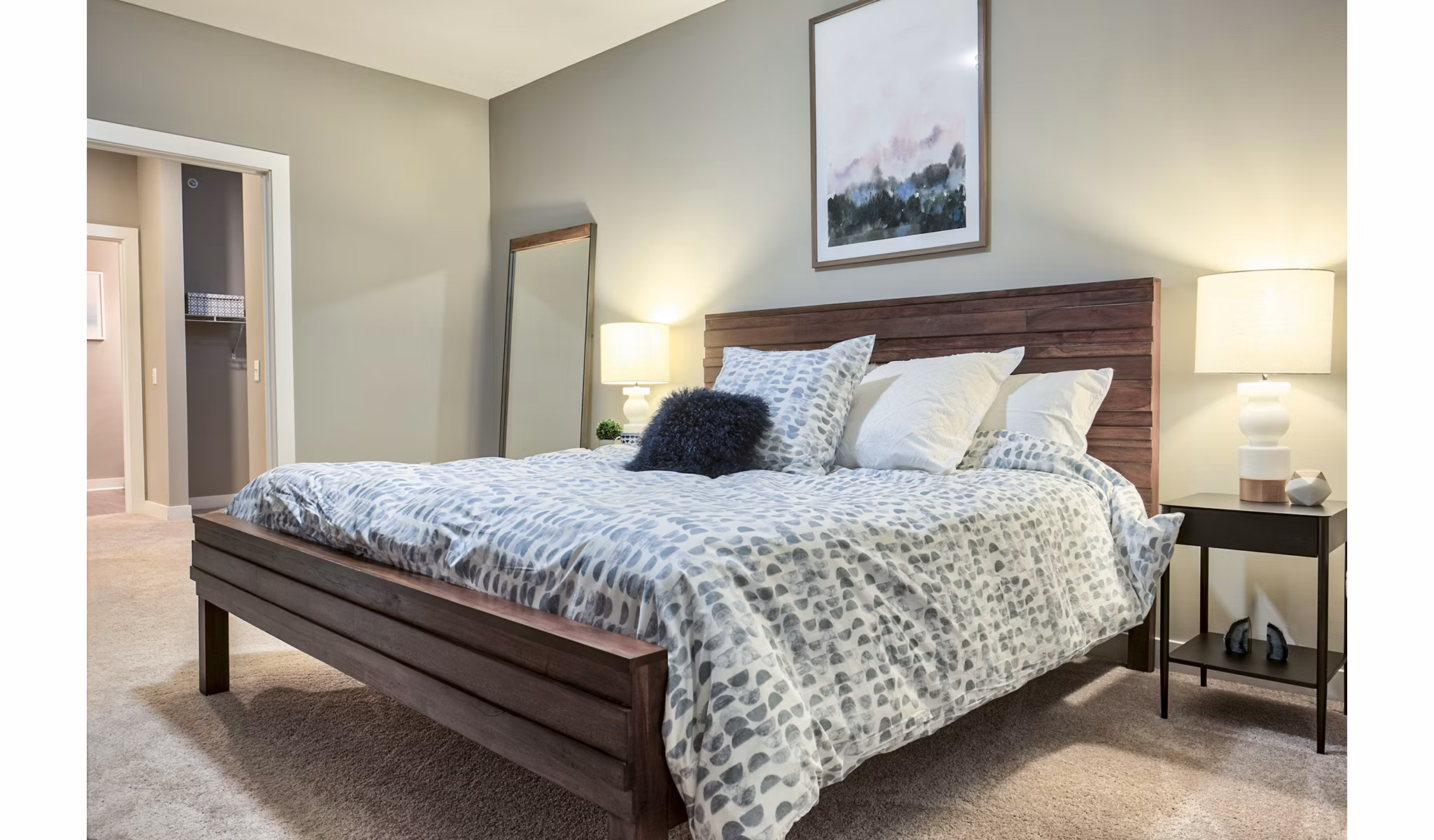 Modern bedroom with sleek furnishings at Ridge at Robinson Apartments