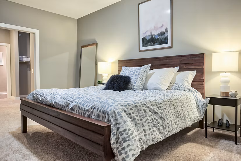 Modern bedroom with sleek furnishings at Ridge at Robinson Apartments