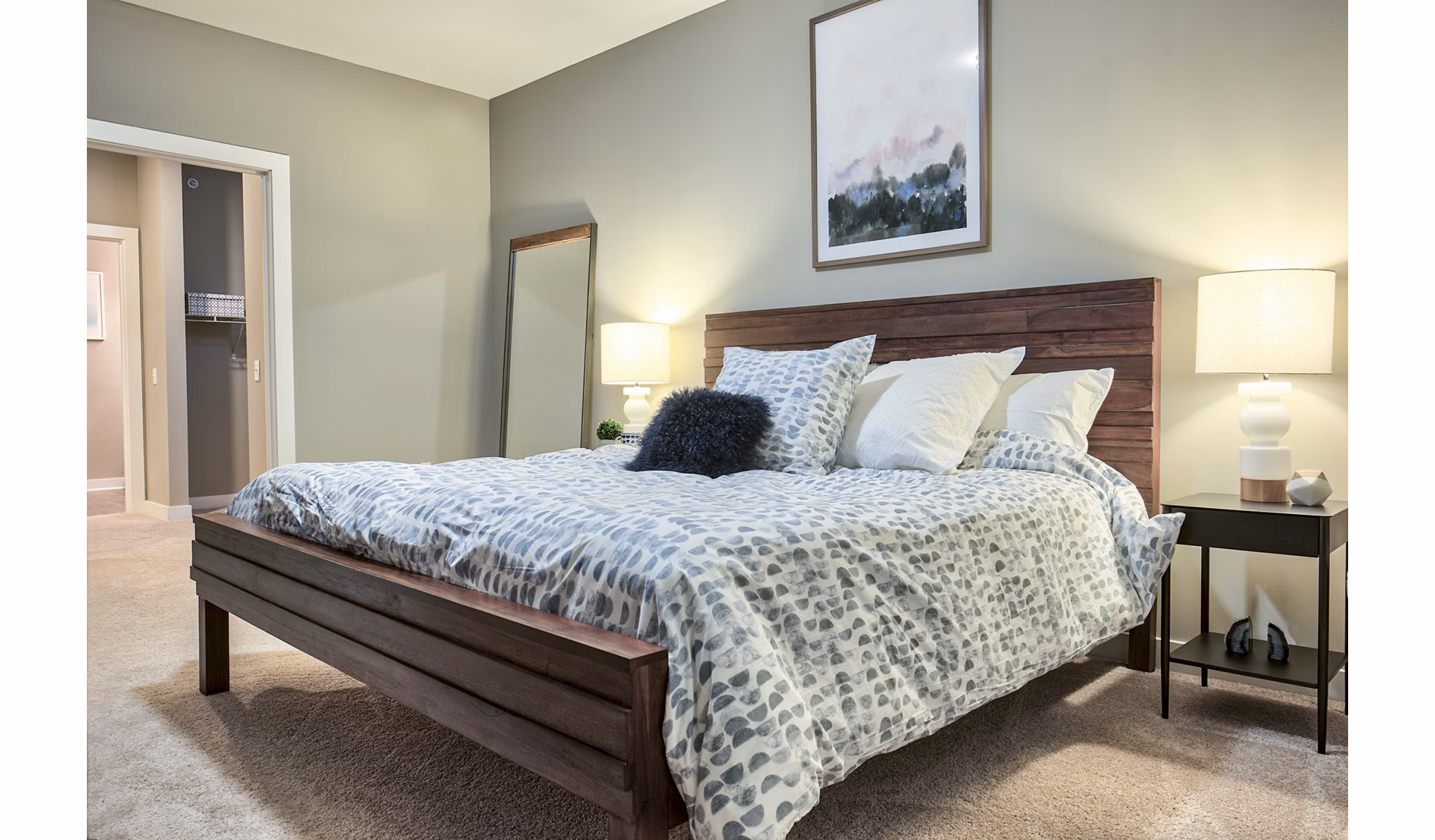Modern bedroom with sleek furnishings at Ridge at Robinson Apartments