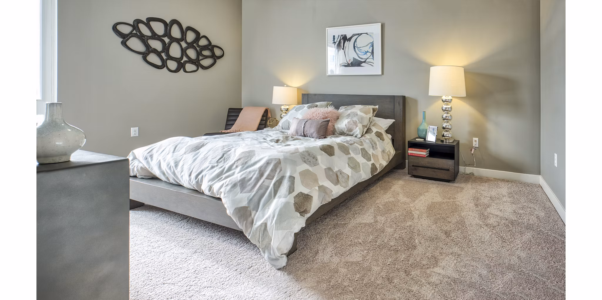 Cozy bedroom with modern furnishings at Ridge at Robinson Apartments