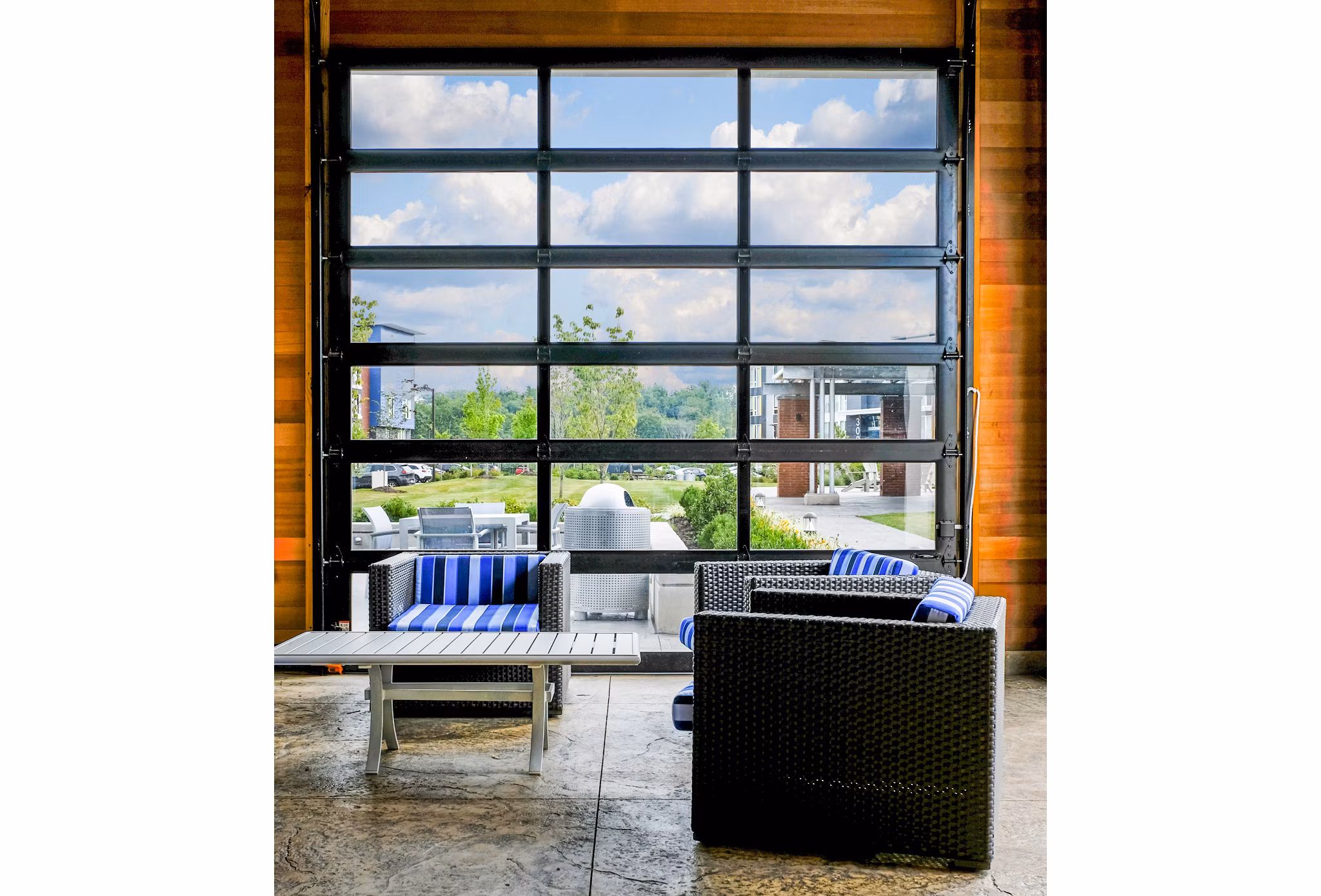 Clubhouse with modern dÃ©cor at Ridge at Robinson Apartments, featuring lounge seating and billiards for resident entertainment