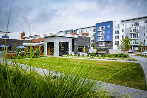 Modern clubhouse with cozy seating and entertainment area at Ridge at Robinson Apartments