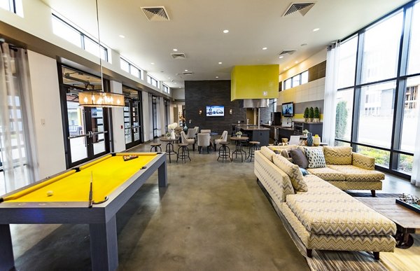 Clubhouse featuring modern design and comfortable seating at Ridge at Robinson Apartments