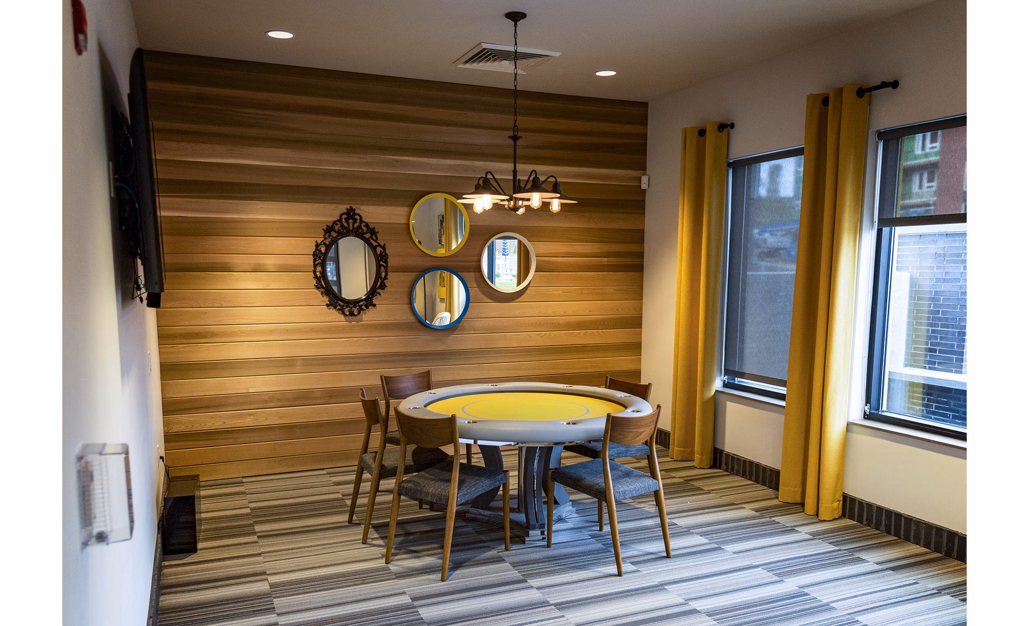 Clubhouse featuring modern furnishings and social spaces at Ridge at Robinson Apartments
