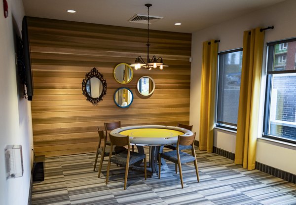 Clubhouse featuring modern furnishings and social spaces at Ridge at Robinson Apartments