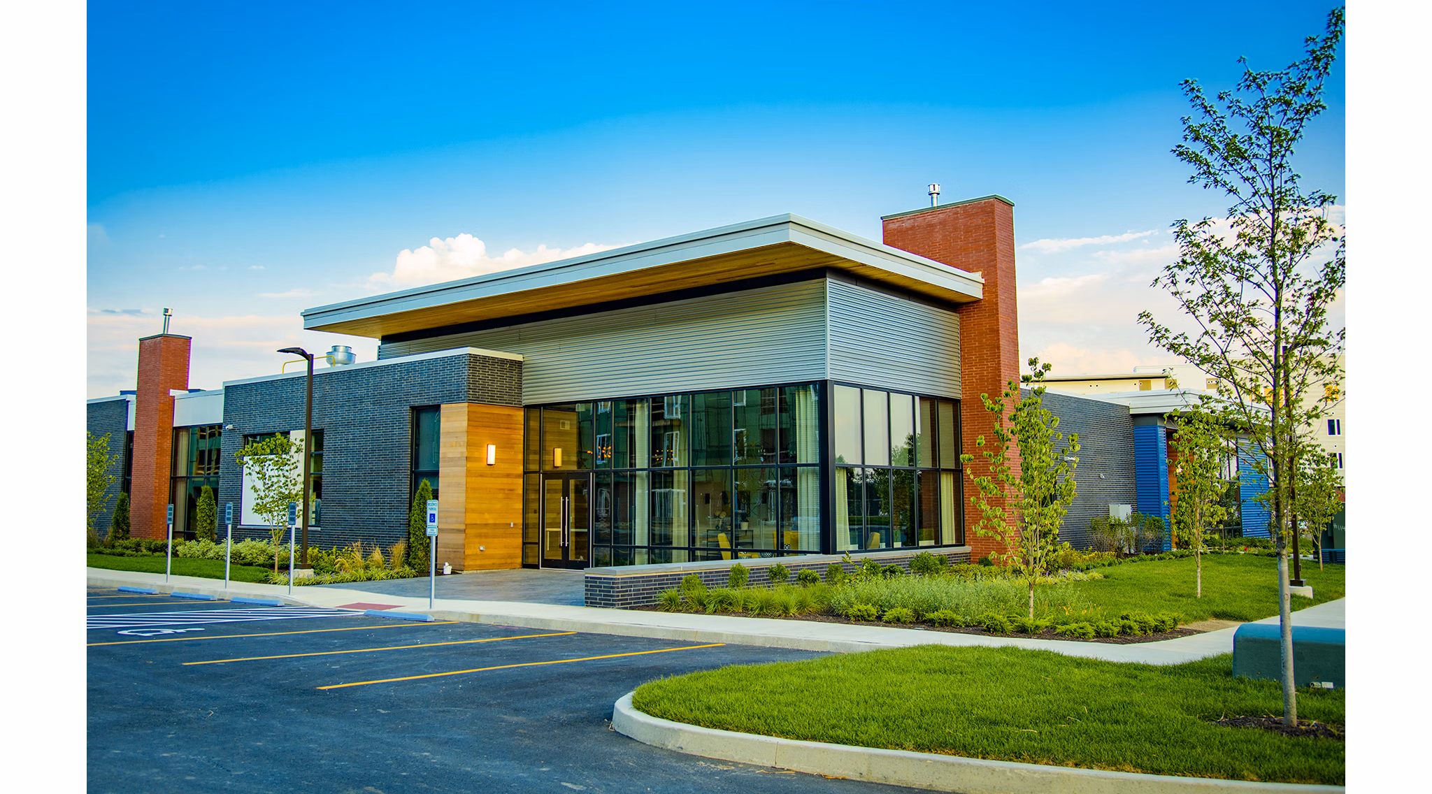 Modern clubhouse with comfortable seating and large windows at Ridge at Robinson Apartments