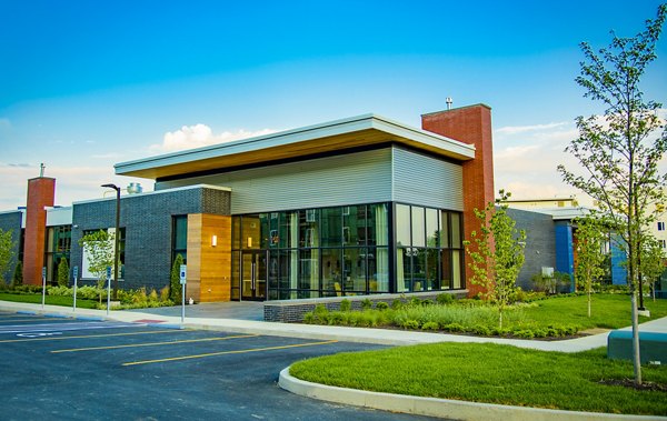 Modern clubhouse with comfortable seating and large windows at Ridge at Robinson Apartments