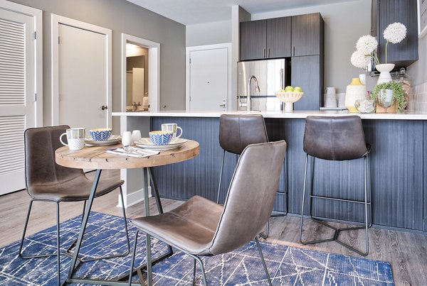 Elegant dining room with modern furnishings at Ridge at Robinson Apartments, ideal for luxury living in our Greystar community