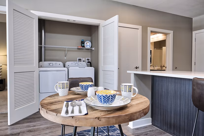 Modern laundry room with energy-efficient appliances at Ridge at Robinson Apartments