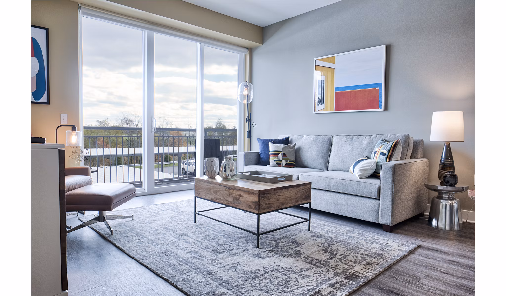 Modern living room with sleek furnishings and natural light at Ridge at Robinson Apartments