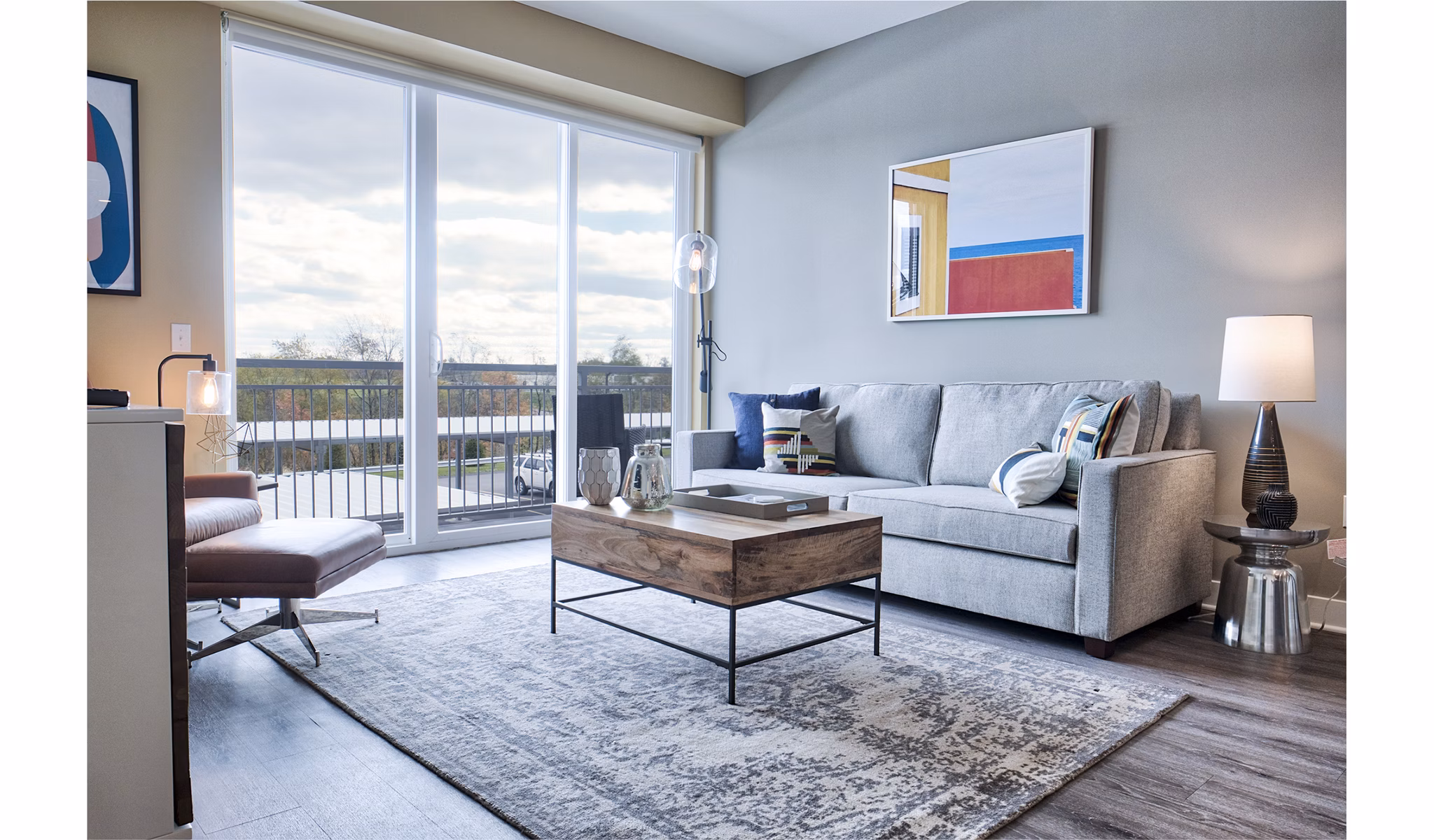 Modern living room with sleek furnishings and natural light at Ridge at Robinson Apartments