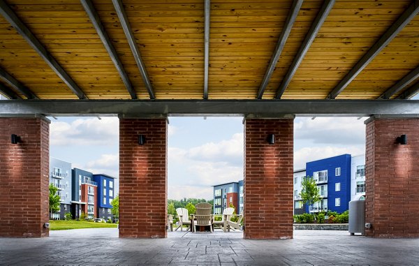 Modern clubhouse with cozy seating areas and pool table at Ridge at Robinson Apartments