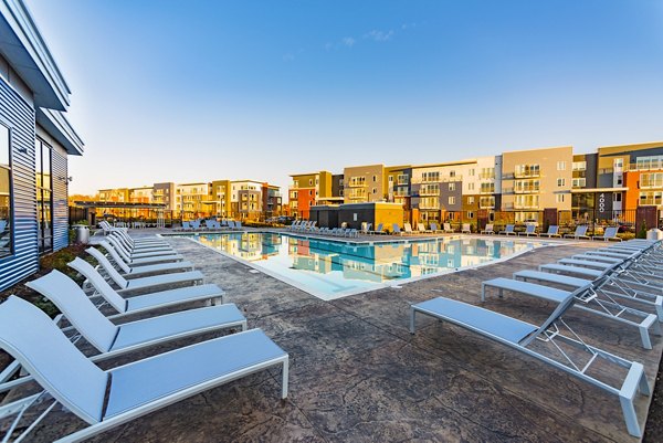 Relaxing pool area at Ridge at Robinson Apartments offering luxury amenities and comfort in a serene setting