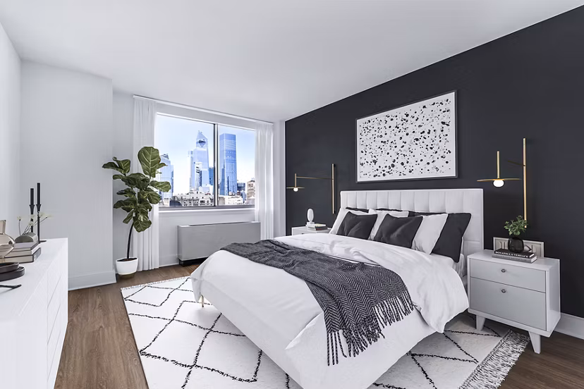 Elegant bedroom with large windows at 800 Sixth Apartments offering a tranquil retreat