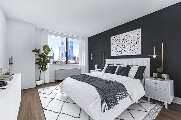 Elegant bedroom with large windows at 800 Sixth Apartments offering a tranquil retreat