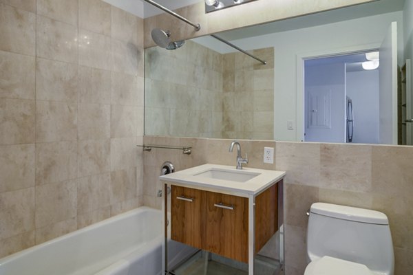 Spacious bathroom with sleek fixtures at 800 Sixth Apartments, luxury living with modern amenities