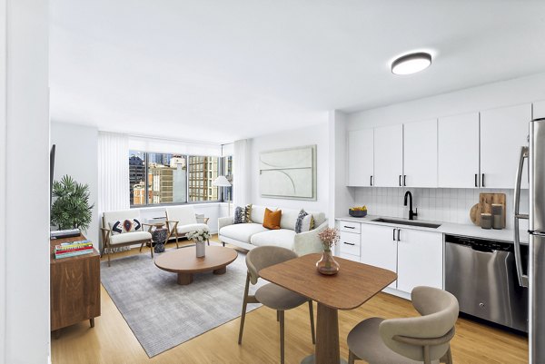 Dining room with modern decor and large windows at 800 Sixth Apartments, offering luxury living in an urban setting
