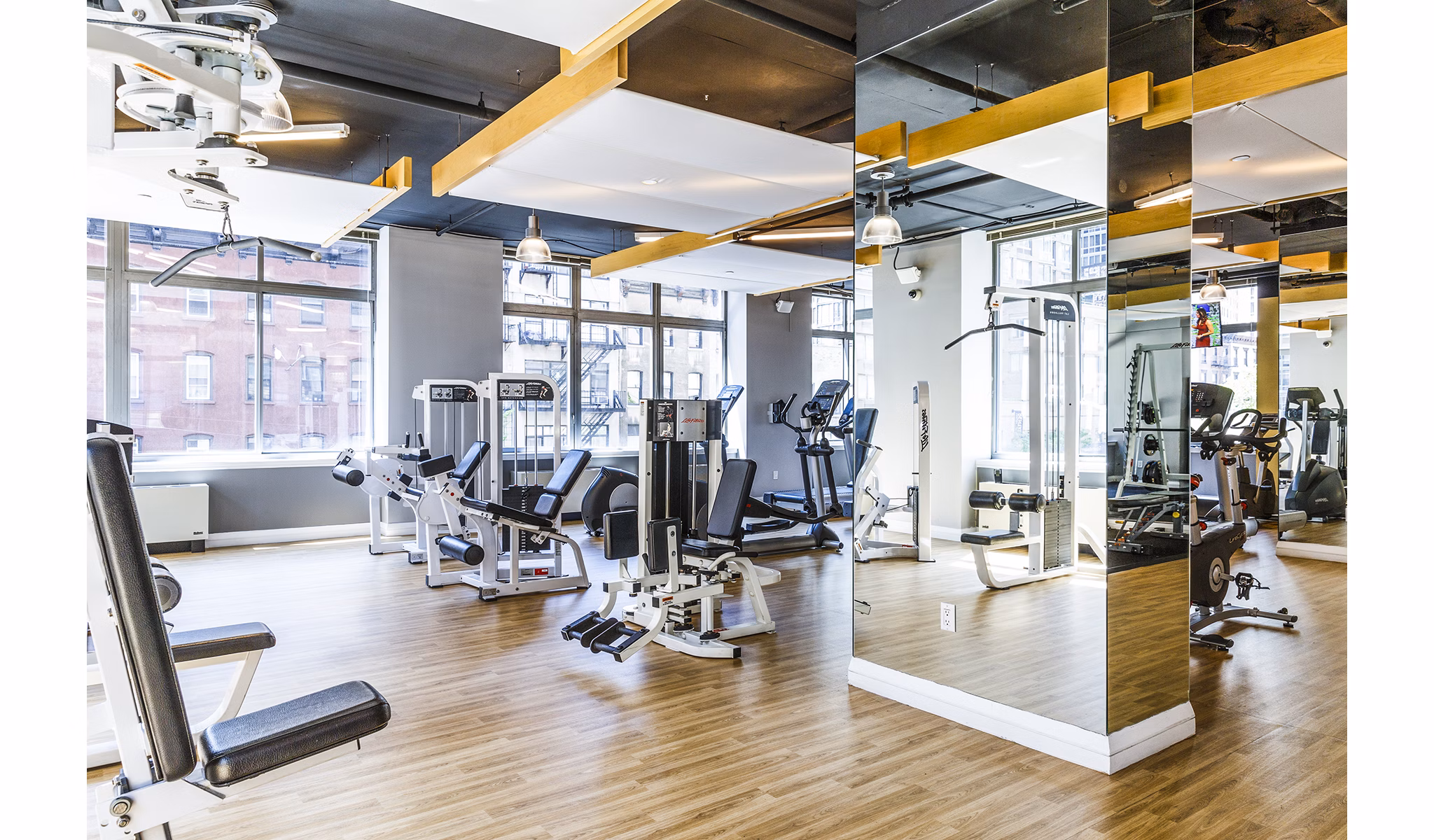 Modern fitness center with state-of-the-art equipment at 800 Sixth Apartments