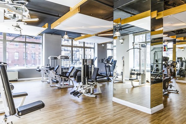Modern fitness center with state-of-the-art equipment at 800 Sixth Apartments