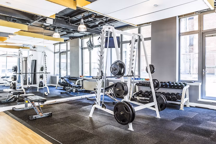 State-of-the-art fitness center at 800 Sixth Apartments with modern equipment and ample workout space for residents