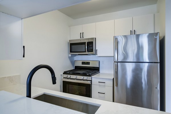 Spacious kitchen with modern appliances at 800 Sixth Apartments
