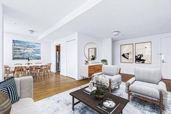 Spacious living room with modern decor at 800 Sixth Apartments, luxury Greystar property in urban setting