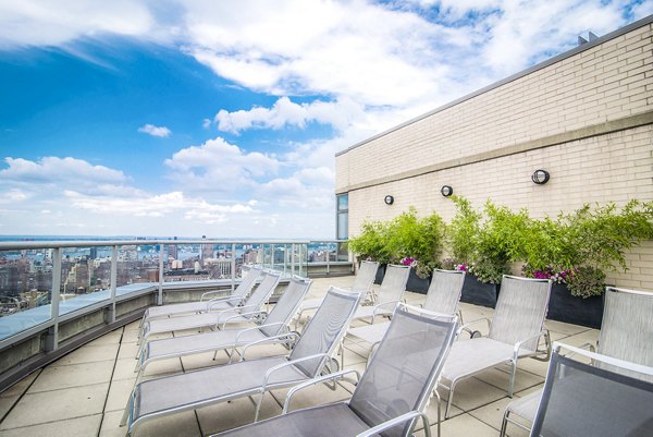 Private patio with modern furniture at 800 Sixth Apartments, offering a serene outdoor space in a luxury urban setting