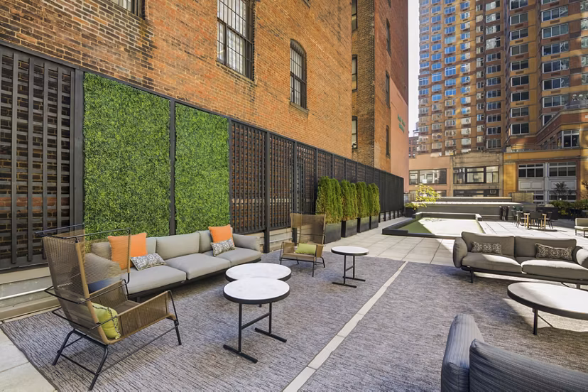 Tranquil courtyard with lush landscaping at 800 Sixth Apartments, downtown living with luxury amenities