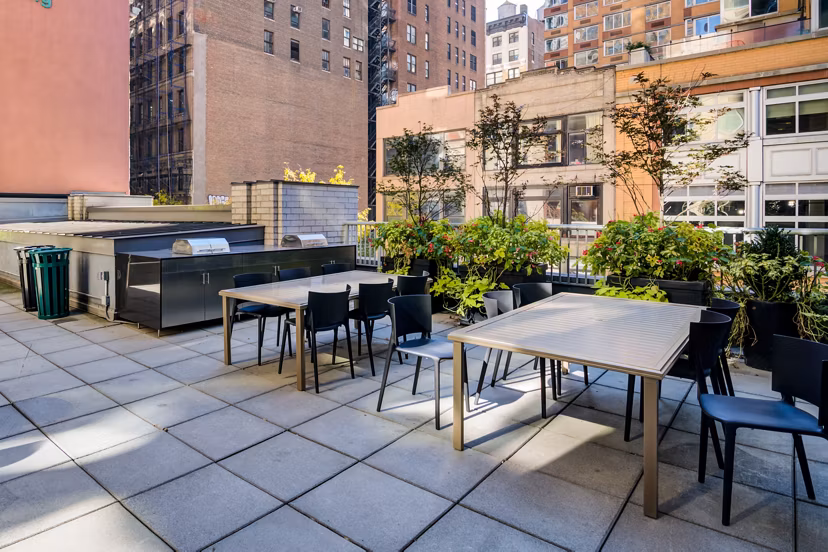 Modern grill area with comfortable seating at 800 Sixth Apartments, luxury community by Greystar