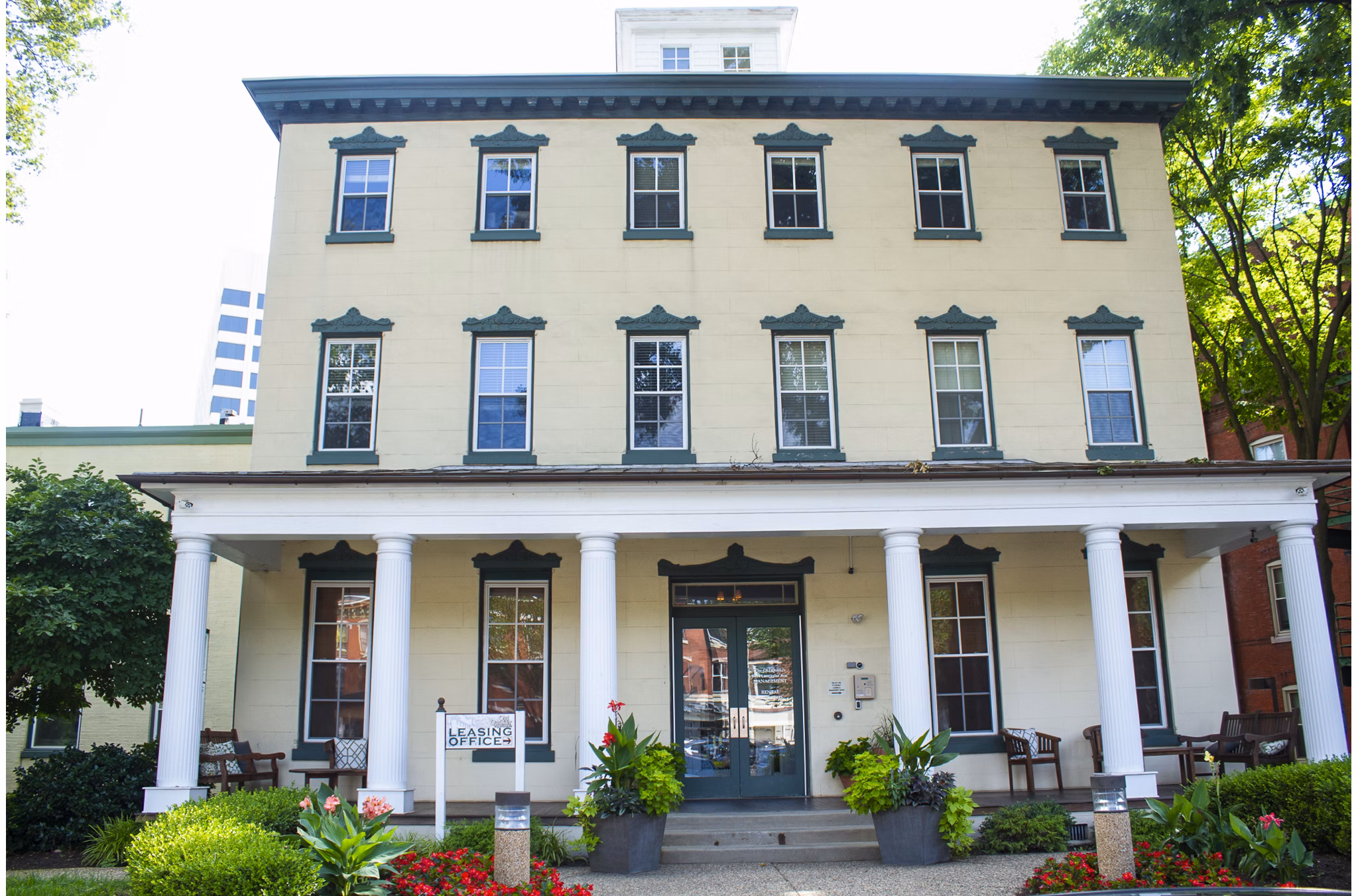 Leasing office with modern decor in Old Quaker Building Apartments, featuring luxury services and amenities for a premium living experience